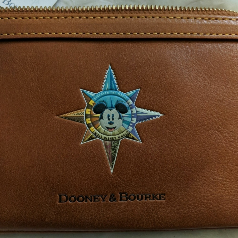 Dooney and Bourke Disney Passport Wristlet 2 avail